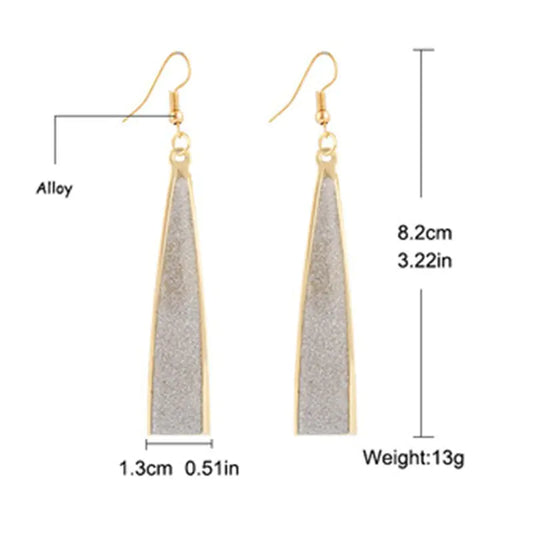 Gold and gray earrings with measurements and material information on a white background
